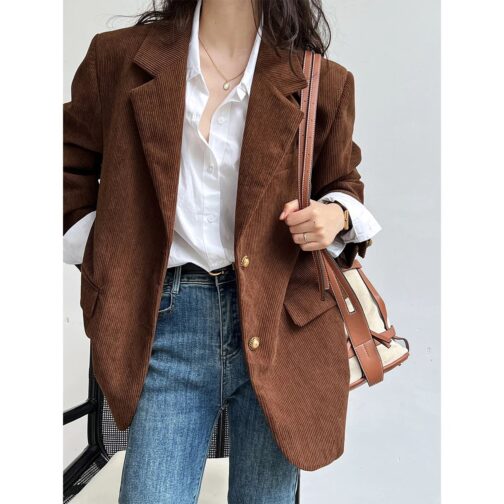 This stylish coat, available in a chic brown beige stripe, seamlessly blends professionalism with contemporary fashion.