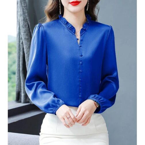 This solid-colored, slim-fit shirt features delicate ruffles, adding a sophisticated touch to your professional look 1