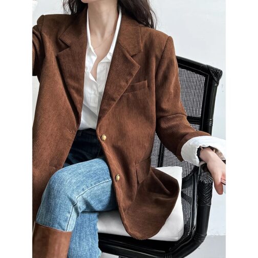 This stylish coat, available in a chic brown beige stripe, seamlessly blends professionalism with contemporary fashion.