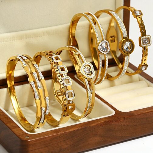 These charming gold color bracelets feature a unique bamboo design inlaid with sparkling crystal zircon hearts, adding a touch of sophistication to any outfit.