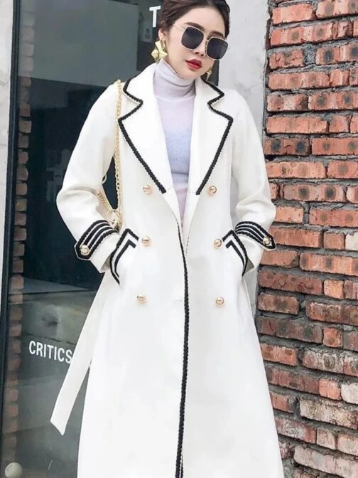 Designed for women with a refined taste, this high-grade coat features a classic double-breasted front and a sophisticated white and black line pattern 2