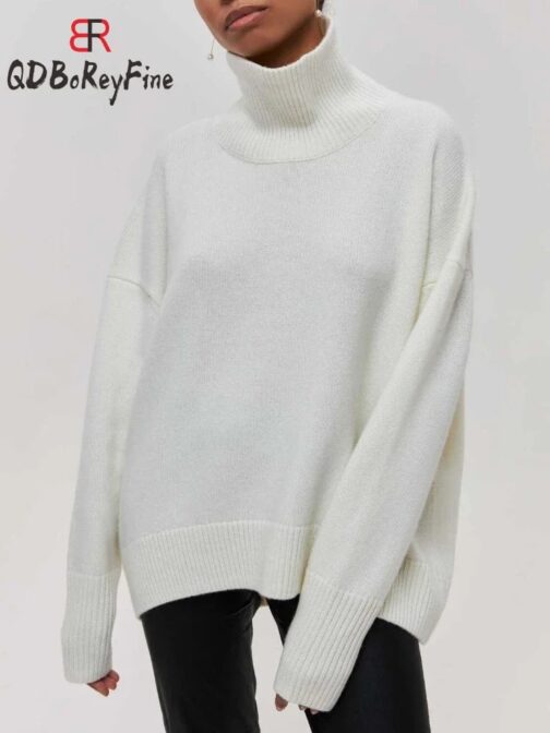 Crafted from thick, warm knitted fabric, this white pullover provides ultimate comfort and insulation against the cold. 4