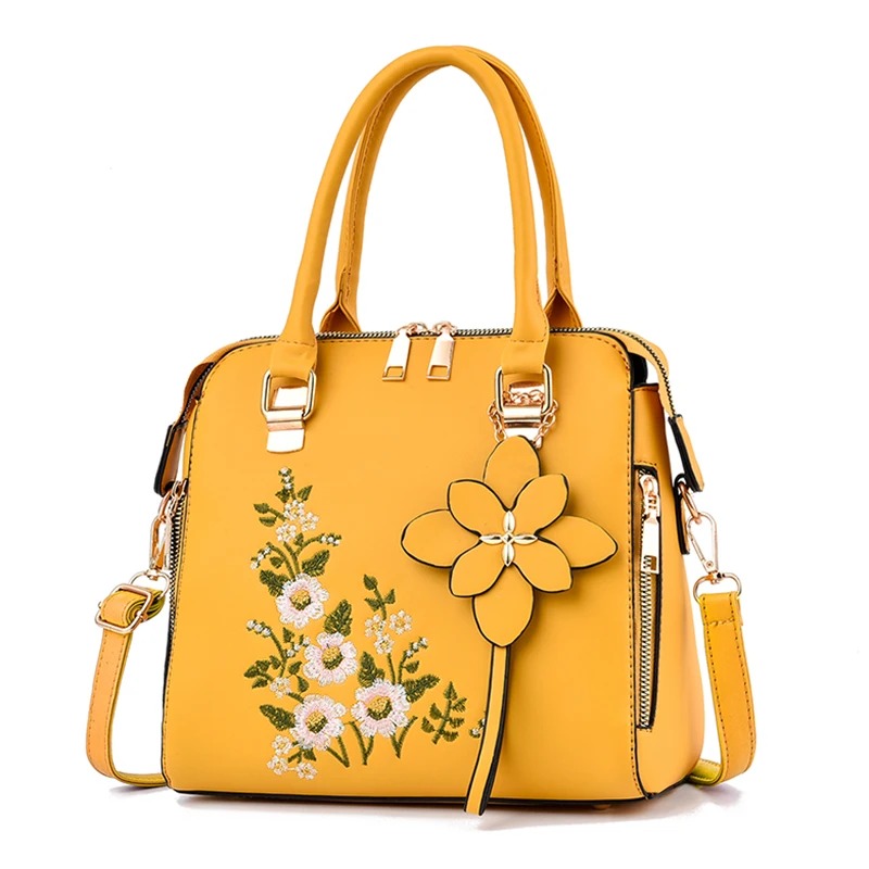 This chic zipper handbag features exquisite floral decor, adding a touch of elegance to any outfit