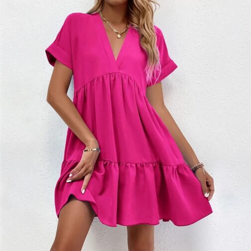 Perfect for spring and summer, this cute dress features a flattering V-neck and a loose, comfortable fit ideal for warm-