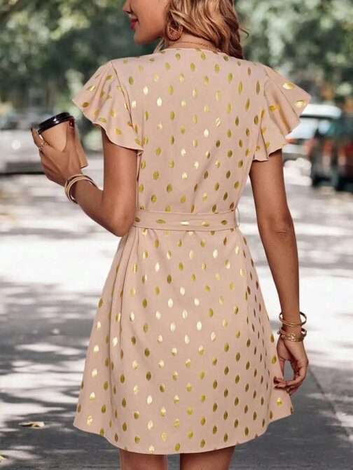 This elegant polka dot dress combines timeless charm with modern sophistication. Its lightweight fabric and flattering silhouette make it perfect for any occasion, from casual outings to special events. 3