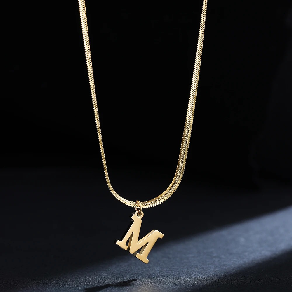 This exquisite piece features an initial letter pendant, beautifully crafted and gold-plated for a luxurious finish. 1