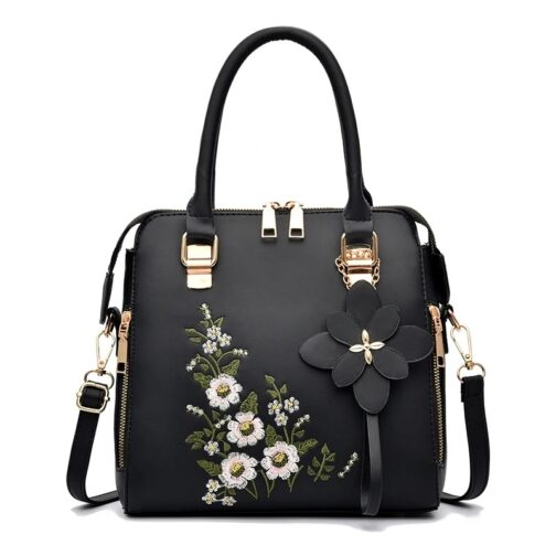 This chic zipper handbag features exquisite floral decor, adding a touch of elegance to any outfit 1