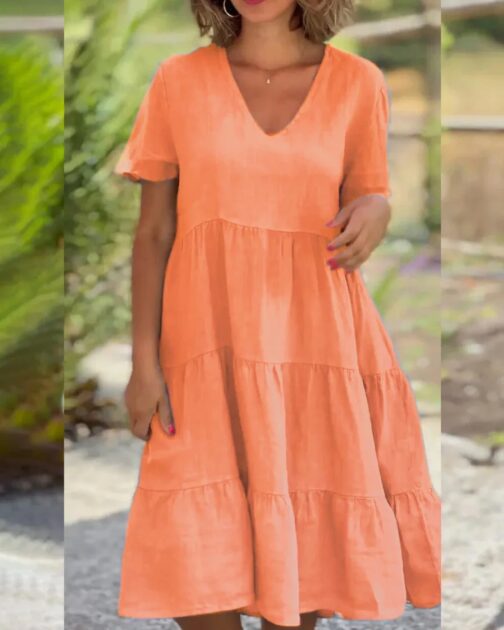 Crafted from a breathable cotton and linen blend, this dress ensures you stay cool and comfortable in warm weather. 4