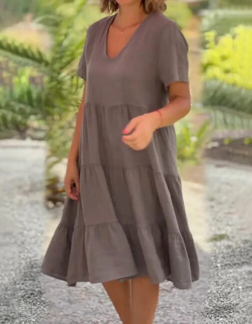 Crafted from a breathable cotton and linen blend, this dress ensures you stay cool and comfortable in warm weather. 5