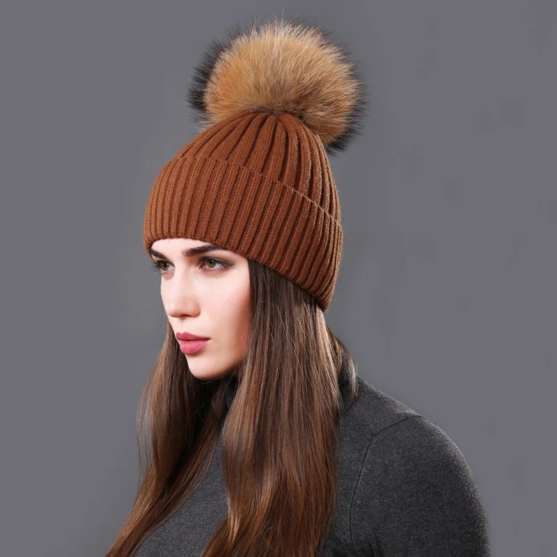 The luxurious raccoon fur pompom adds a fashionable touch, making it perfect for casual outings, travel, or everyday wear 1