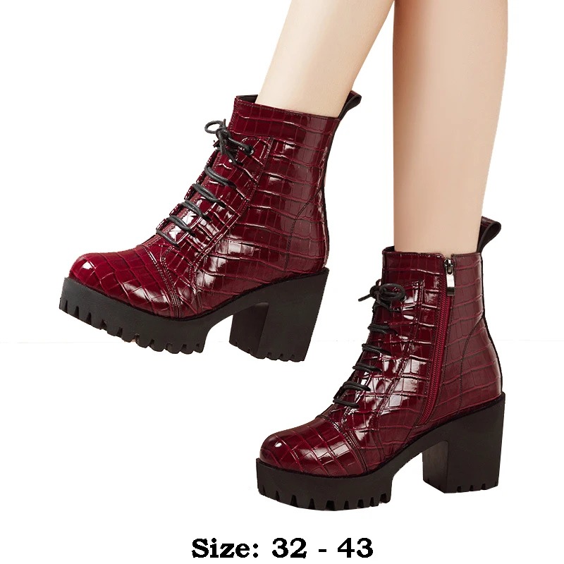 Available in classic black and vibrant red, these ankle boots effortlessly elevate any outfit, from jeans and skirts to dresses. 1
