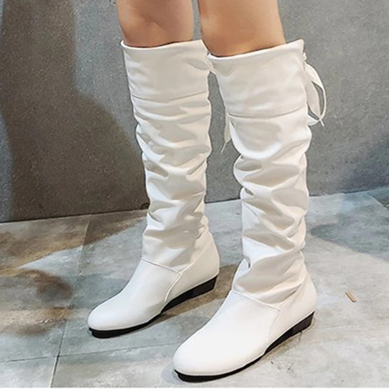 The knee-high length provides warmth and coverage during cooler seasons, while the versatile design pairs effortlessly with skirts, dresses, or leggings 2