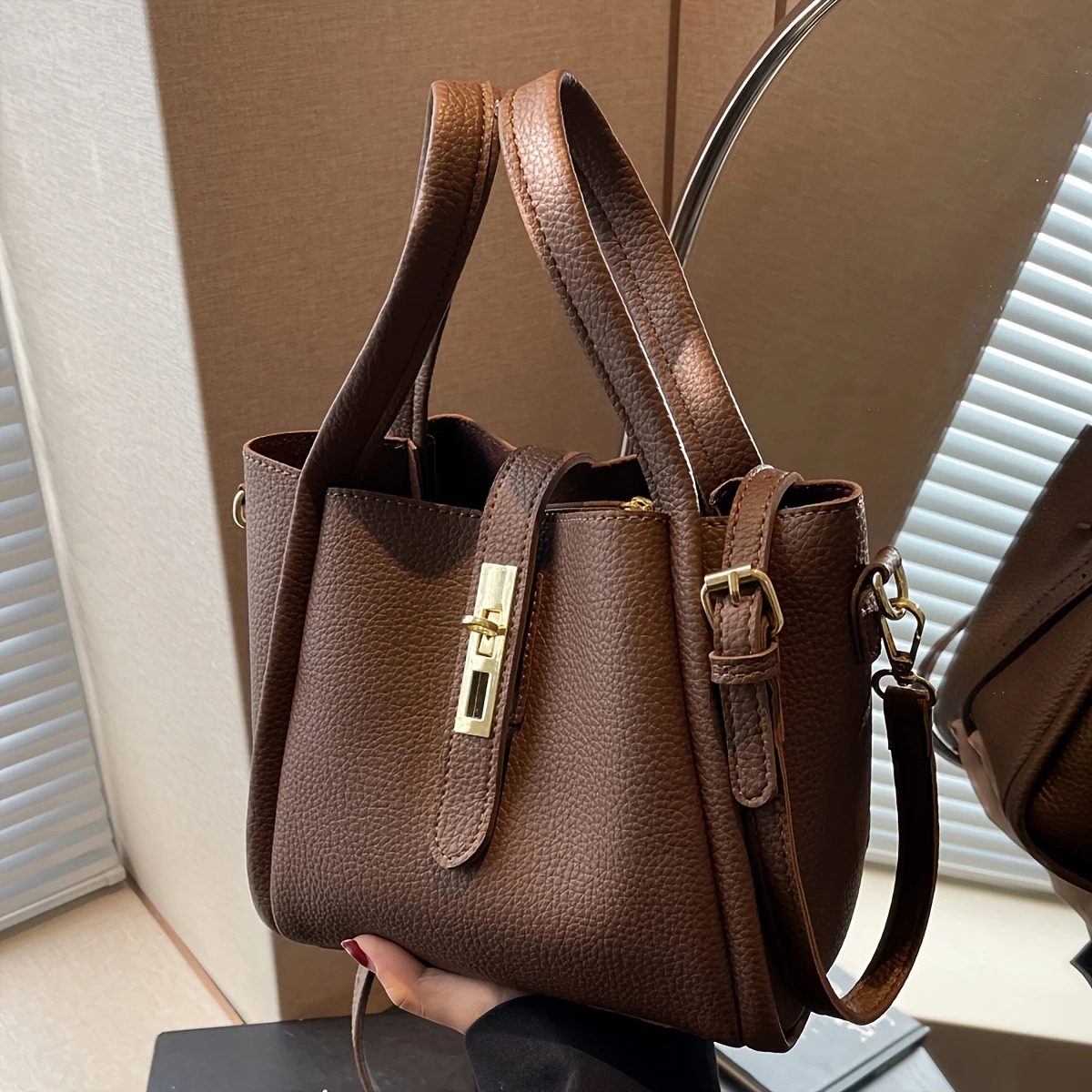 Featuring a retro-inspired silhouette and simple solid color design, this crossbody bag delivers timeless style with modern practicality 1
