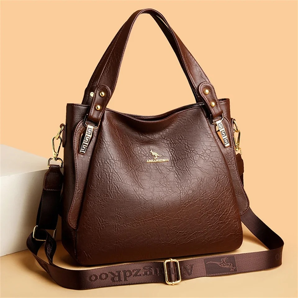 Crafted from soft, high-quality genuine leather, this branded women’s handbag delivers a luxurious feel and long-lasting durability. 1