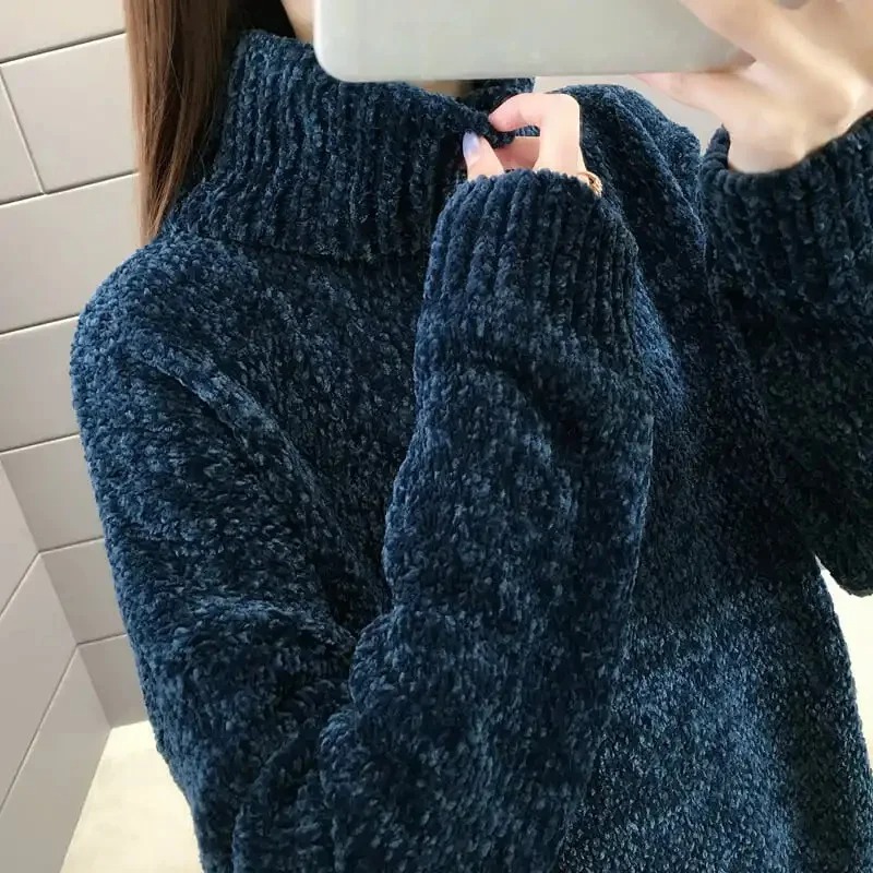 The soft knit fabric feels cozy against the skin, making it ideal as a warm base shirt or a stylish standalone top